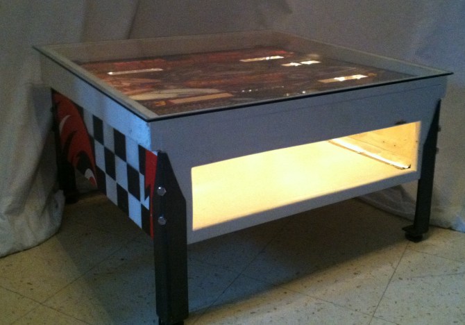 Bally Ground Shaker pinball scoreboard console redesigned into a coffee table with magazine storage. 31”L x 28 1/2“W x 17” H